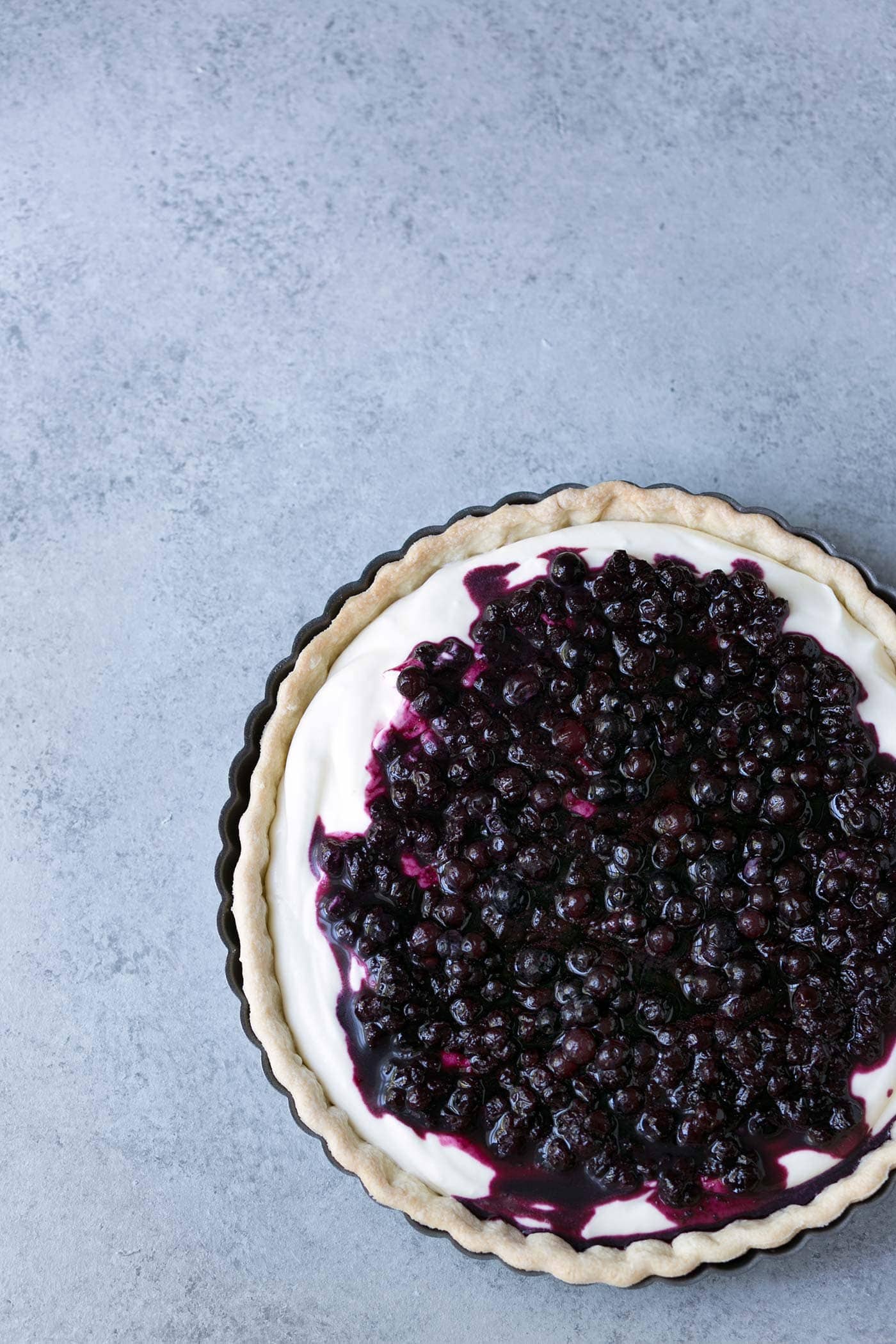 This Wild Blueberry Lemon Cream Tart is surprisingly light and delicate. Served chilled or at room temperature, it’s a perfect summer dessert. SavorySimple.net