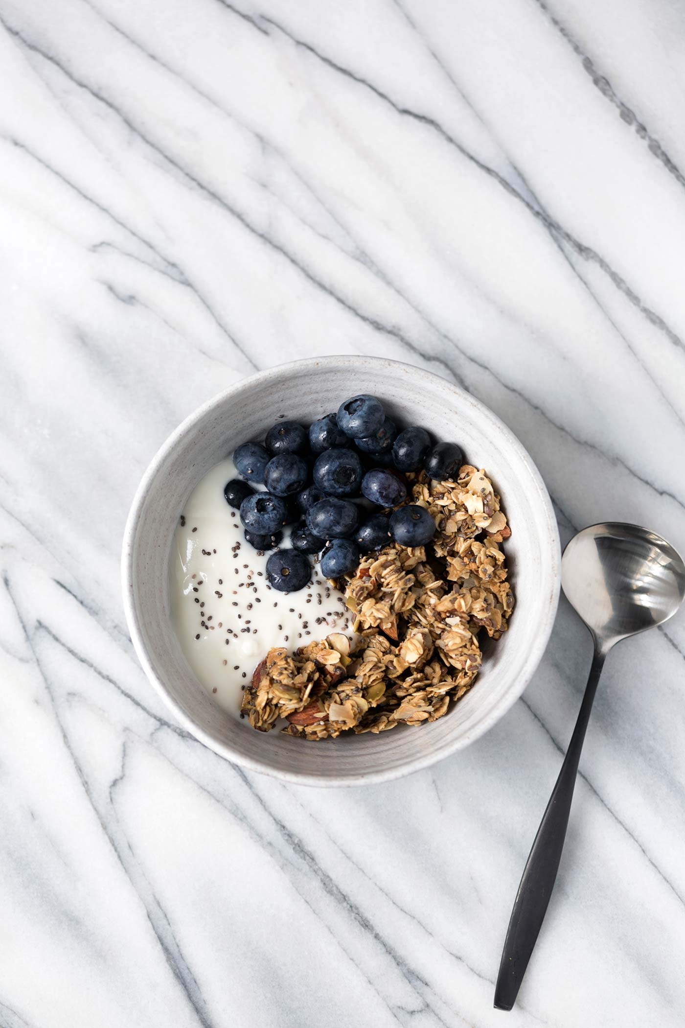 This Granola Yogurt Breakfast Bowl features an easy homemade granola that can be prepared in advanced for weeks worth of quick, delicious, healthy breakfasts. SavorySimple.net