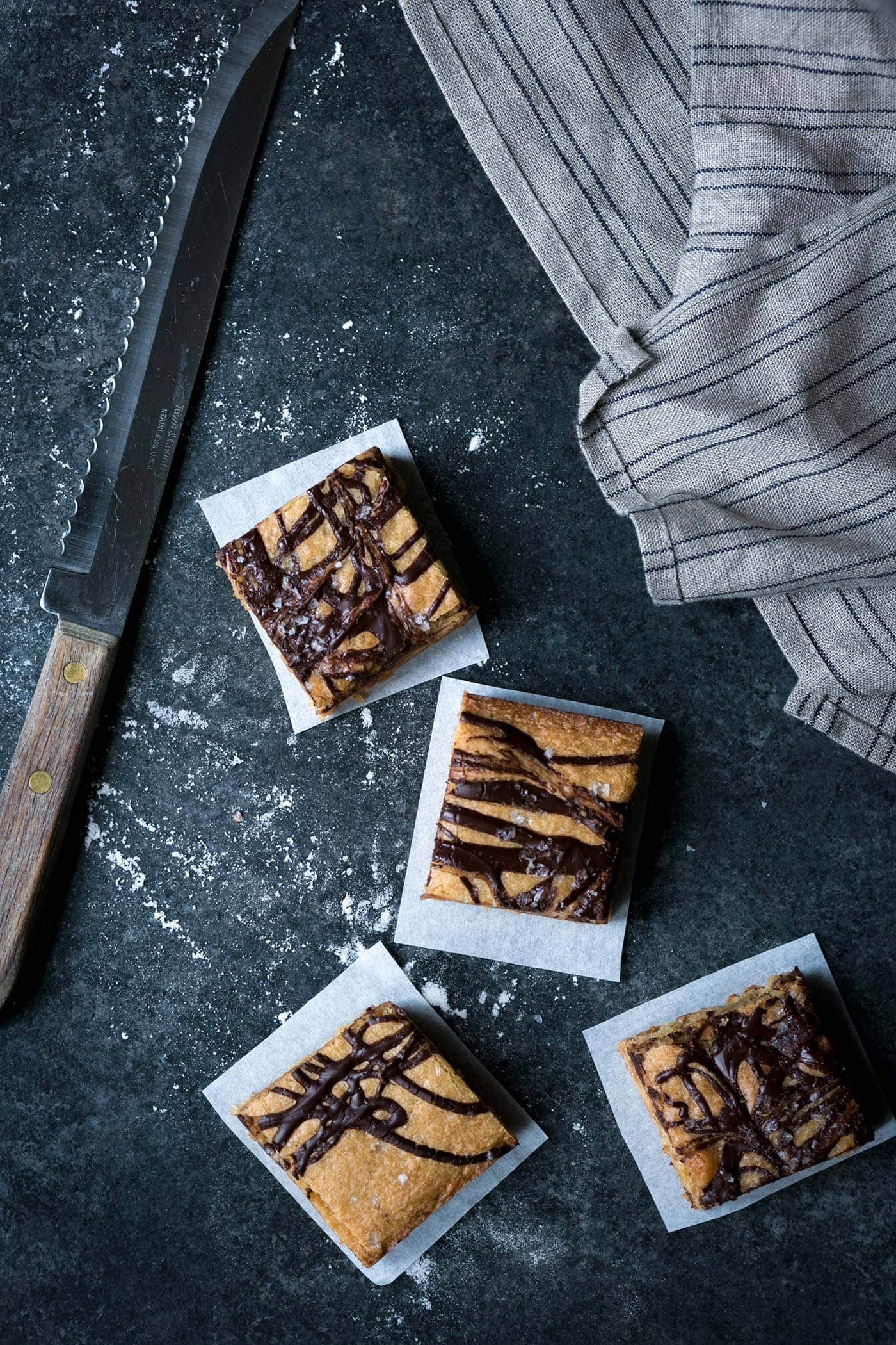 These decadent Salted Chocolate-Swirled Tahini Cashew Bars are soft, rich, and a perfect balance of flavors. Perfect for parties! SavorySimple.net