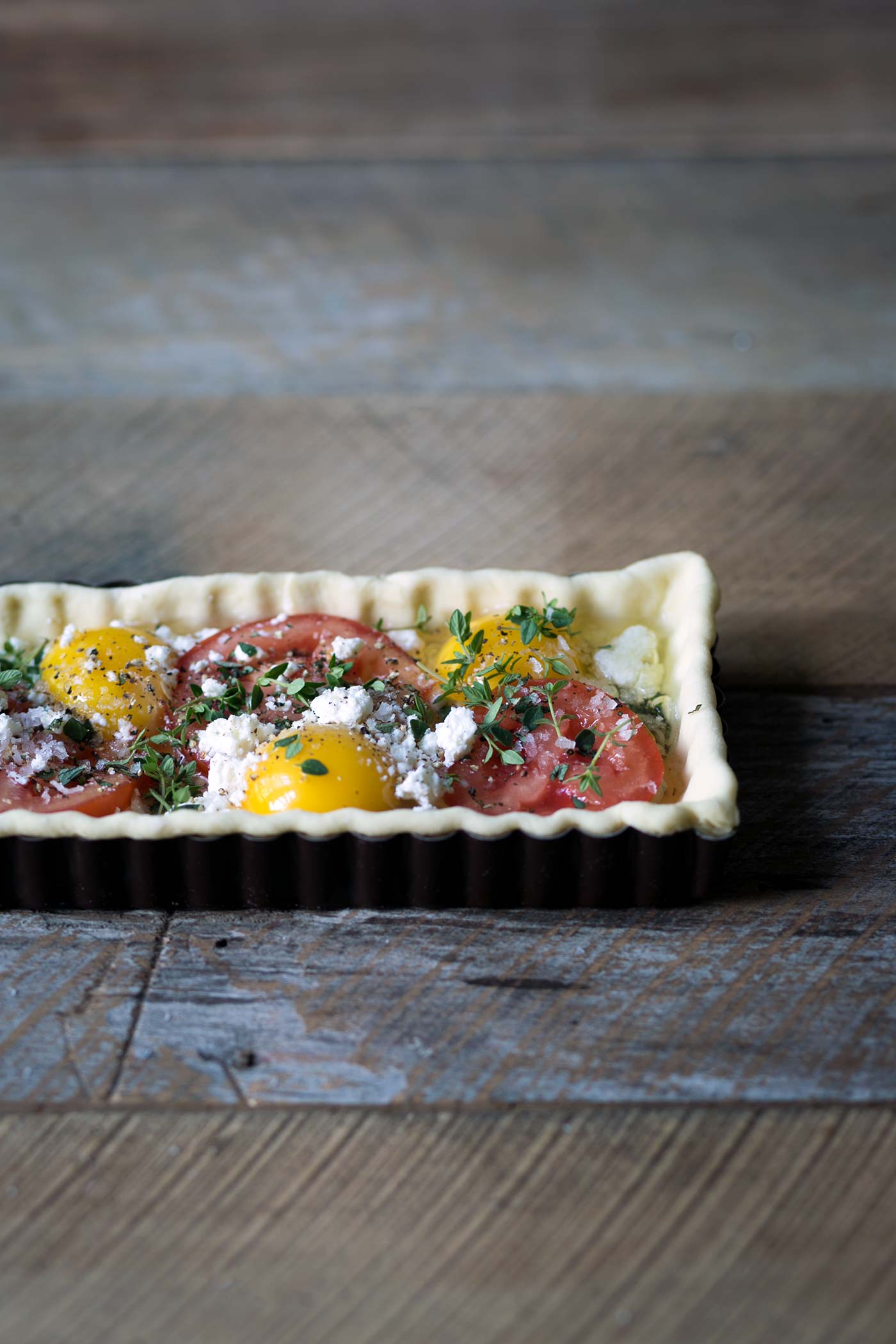 This Tomato Feta Egg Tart is perfect as an appetizer, side dish, or even for breakfast. It’s beautiful and incredibly delicious. SavorySimple.net