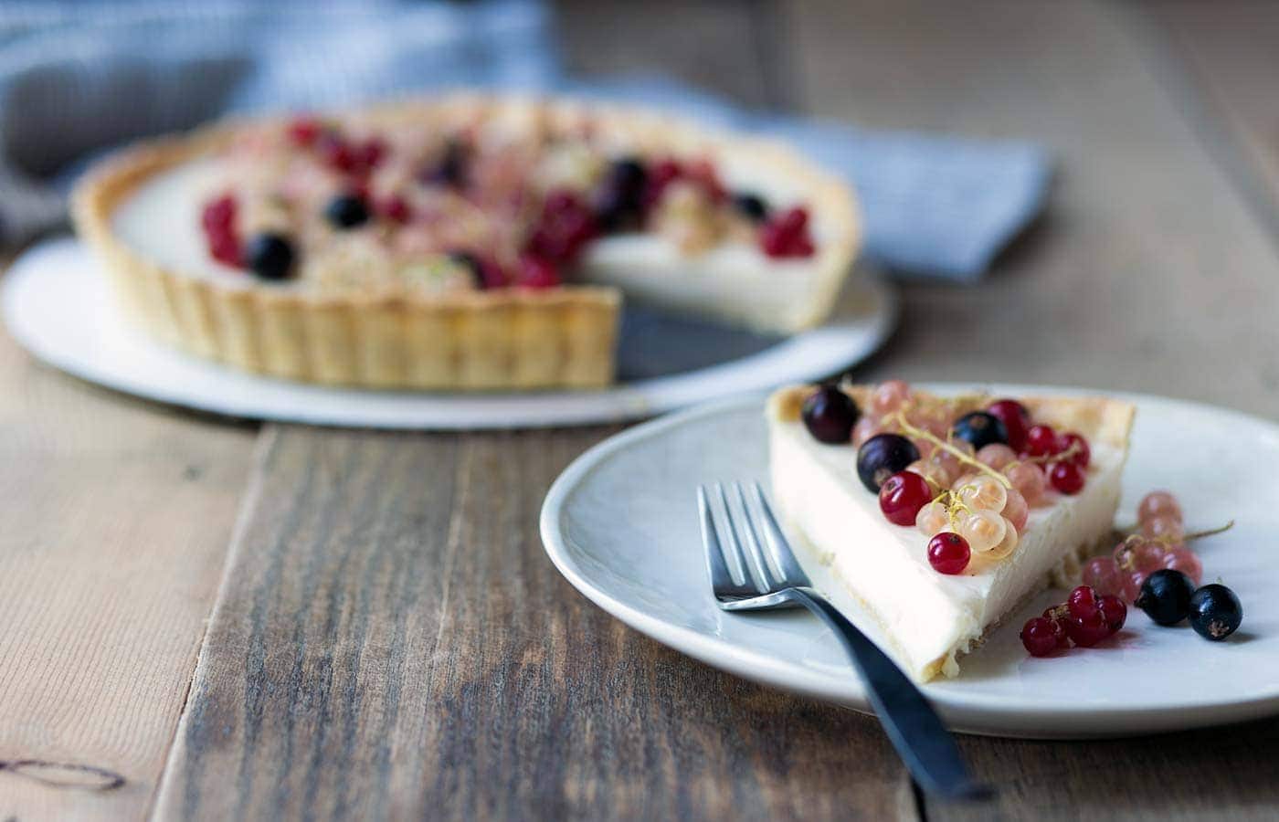 This Mixed Currant Panna Cotta Tart is a light, beautiful dessert that will wow your guests! SavorySimple.net