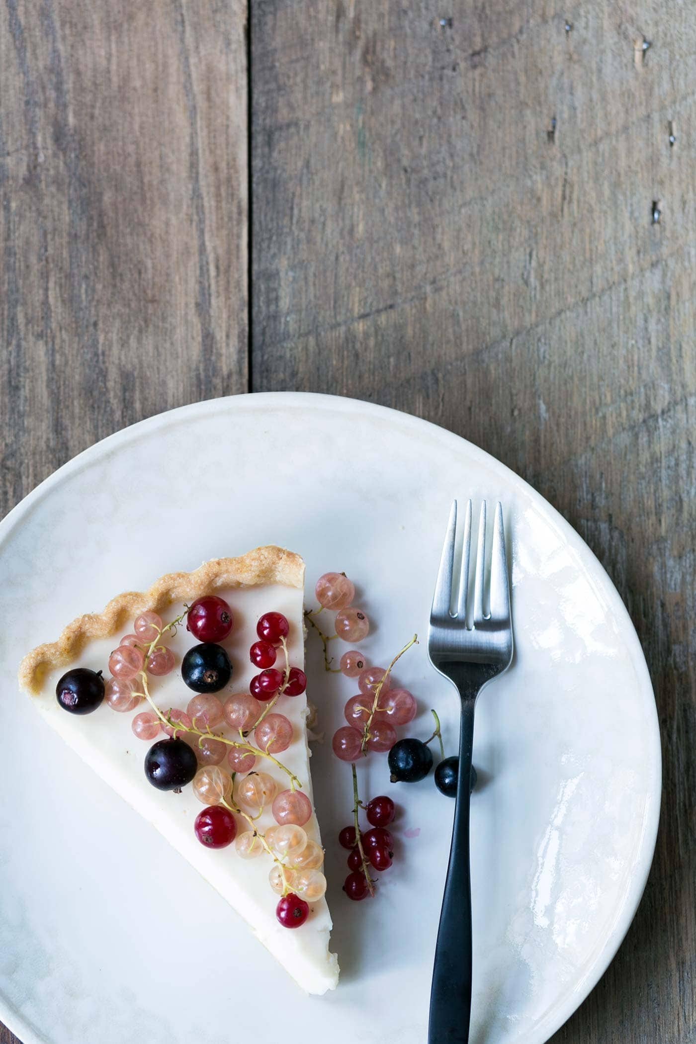This Mixed Currant Panna Cotta Tart is a light, beautiful dessert that will wow your guests! SavorySimple.net