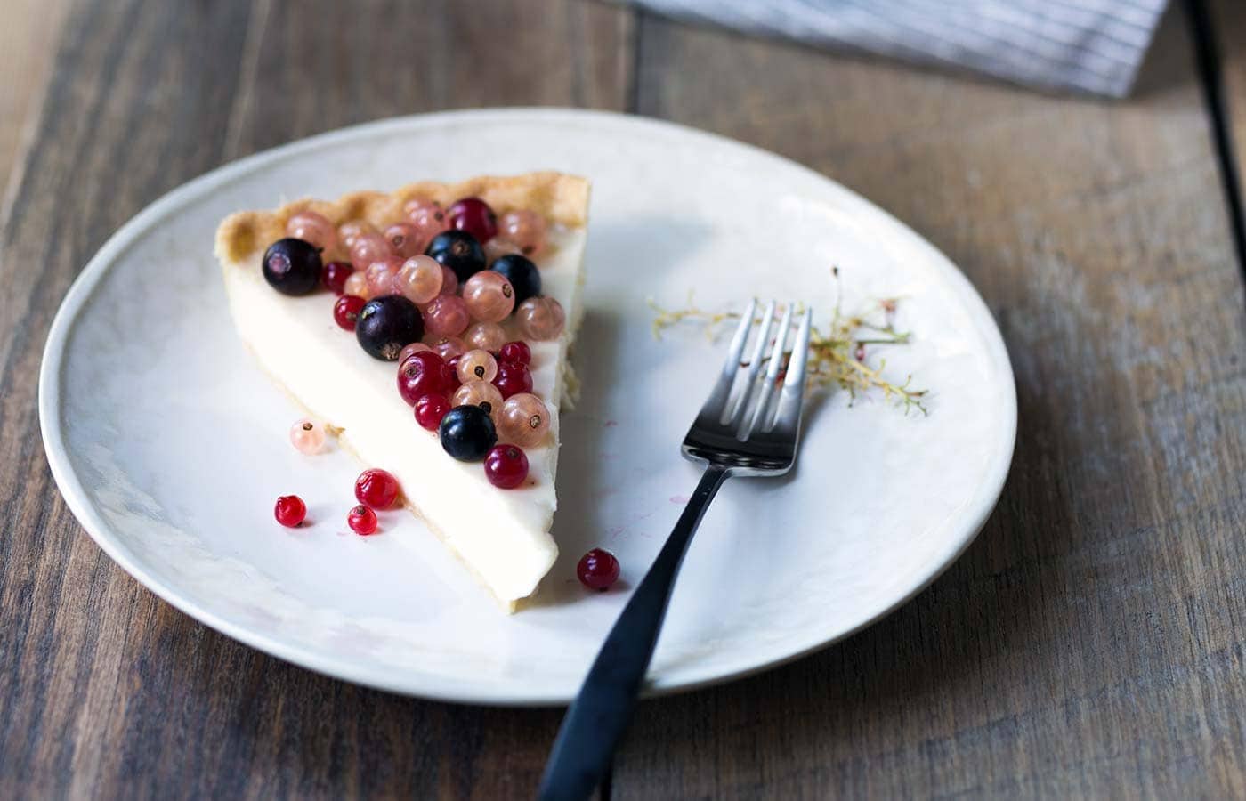 This Mixed Currant Panna Cotta Tart is a light, beautiful dessert that will wow your guests! SavorySimple.net