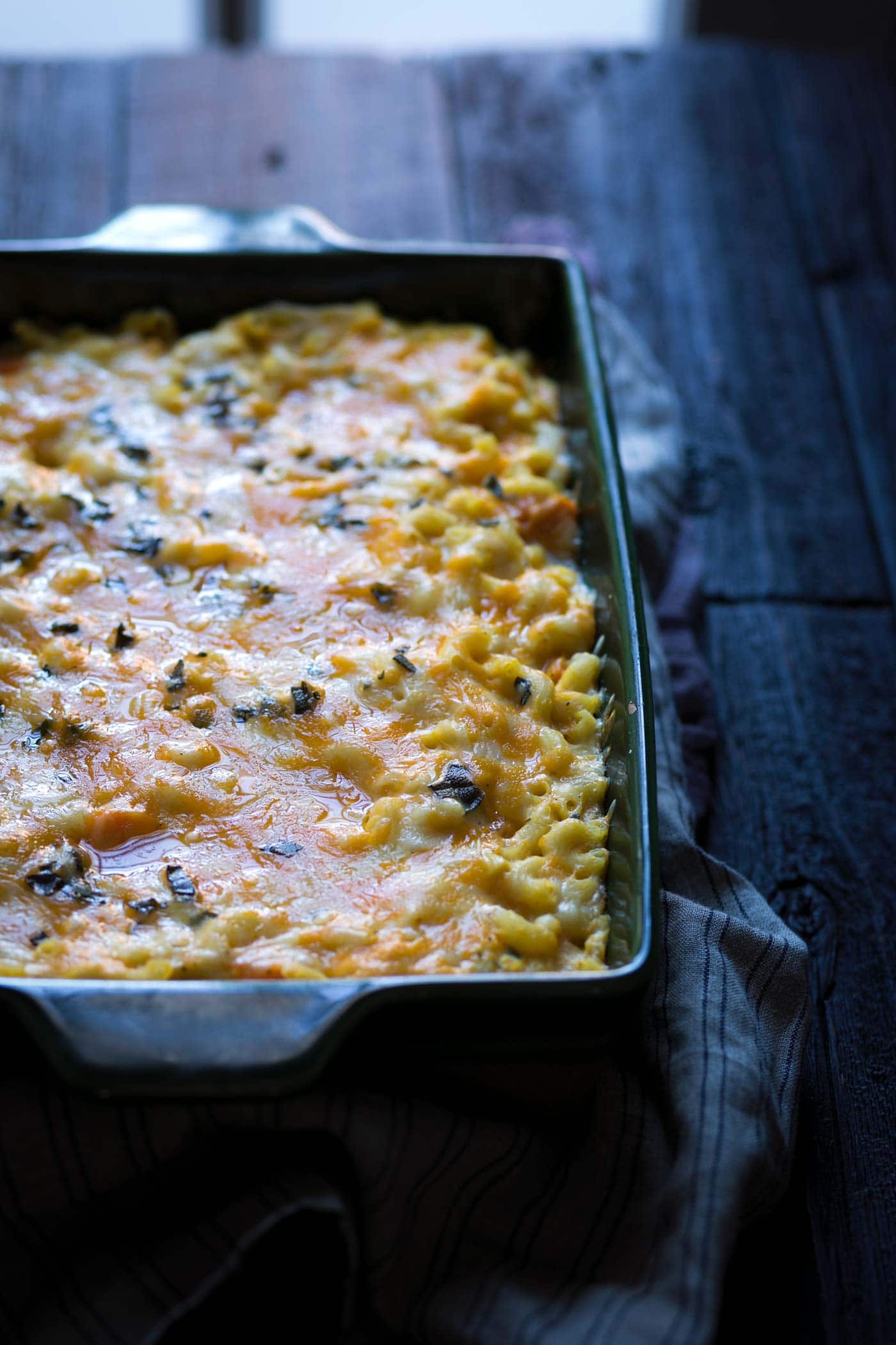 A photo of baked butternut squash macaroni and cheese, right out of the oven.