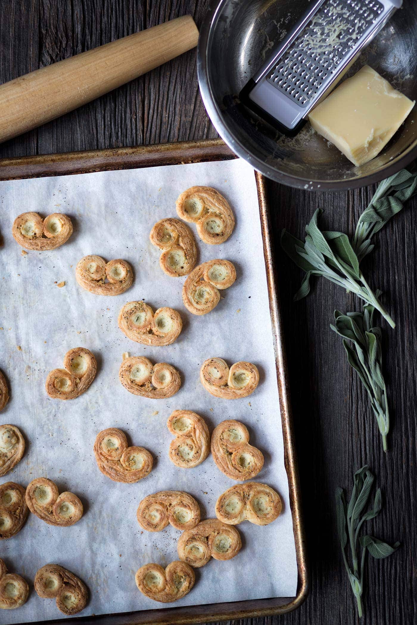 Savory Palmiers with Cheese and Herbs are perfect party food! Prepare them in advance and serve at room temperature with wine or cocktails.