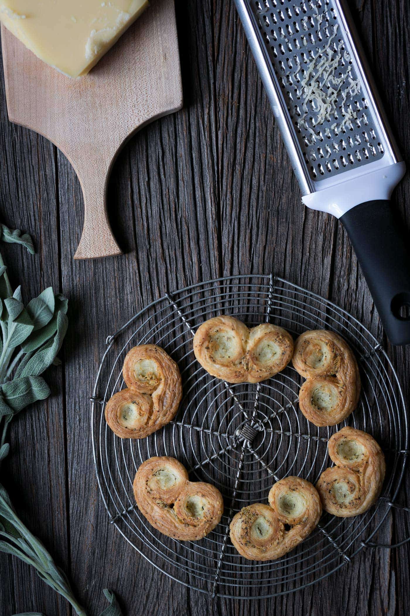 Savory Palmiers with Cheese and Herbs are perfect party food! Prepare them in advance and serve at room temperature with wine or cocktails.