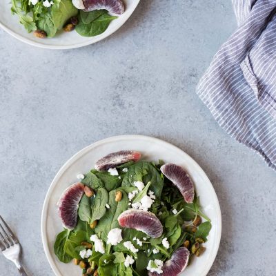 overhead image: 2 plates of spring mix salad
