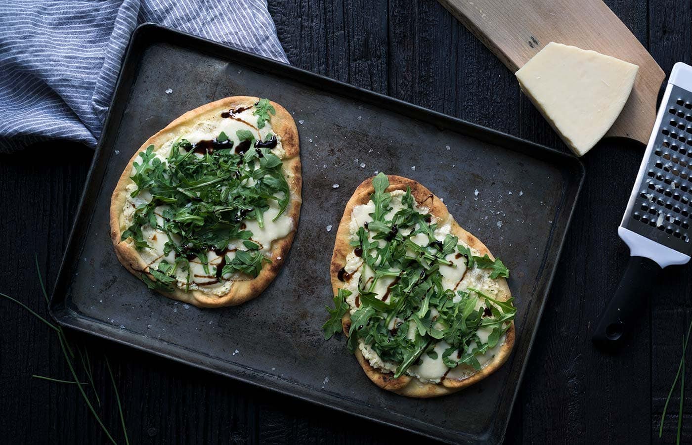This Three-Cheese Naan Pizza with Arugula and Balsamic is perfect as a party appetizer or a quick meal! Get the recipe from Savory Simple.
