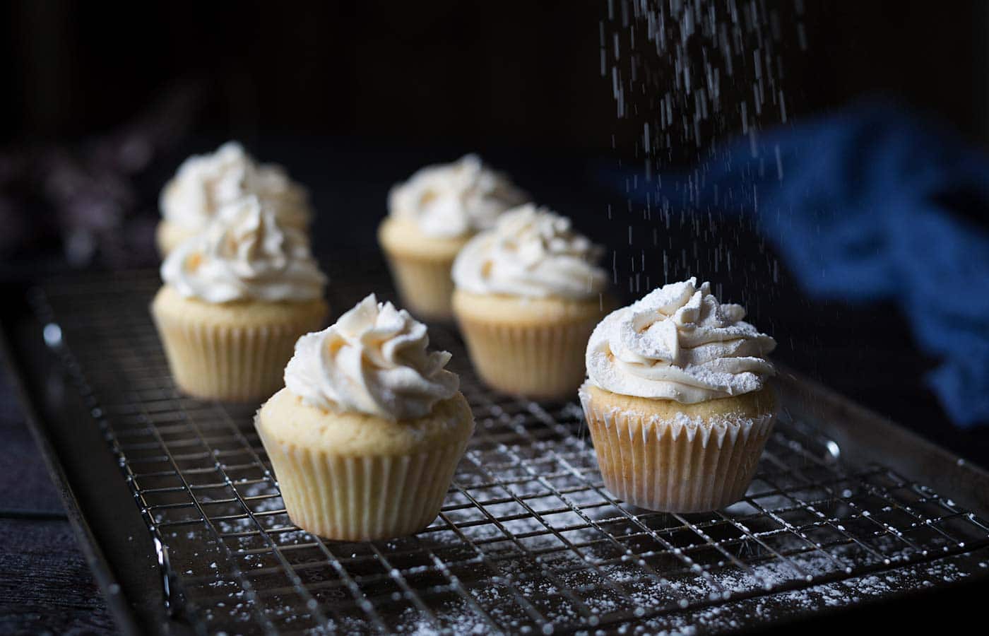 These Vanilla Maple Whiskey Cupcakes are a boozy delight, with a buttery maple center and a vanilla whiskey buttercream. Get the recipe from Savory Simple!