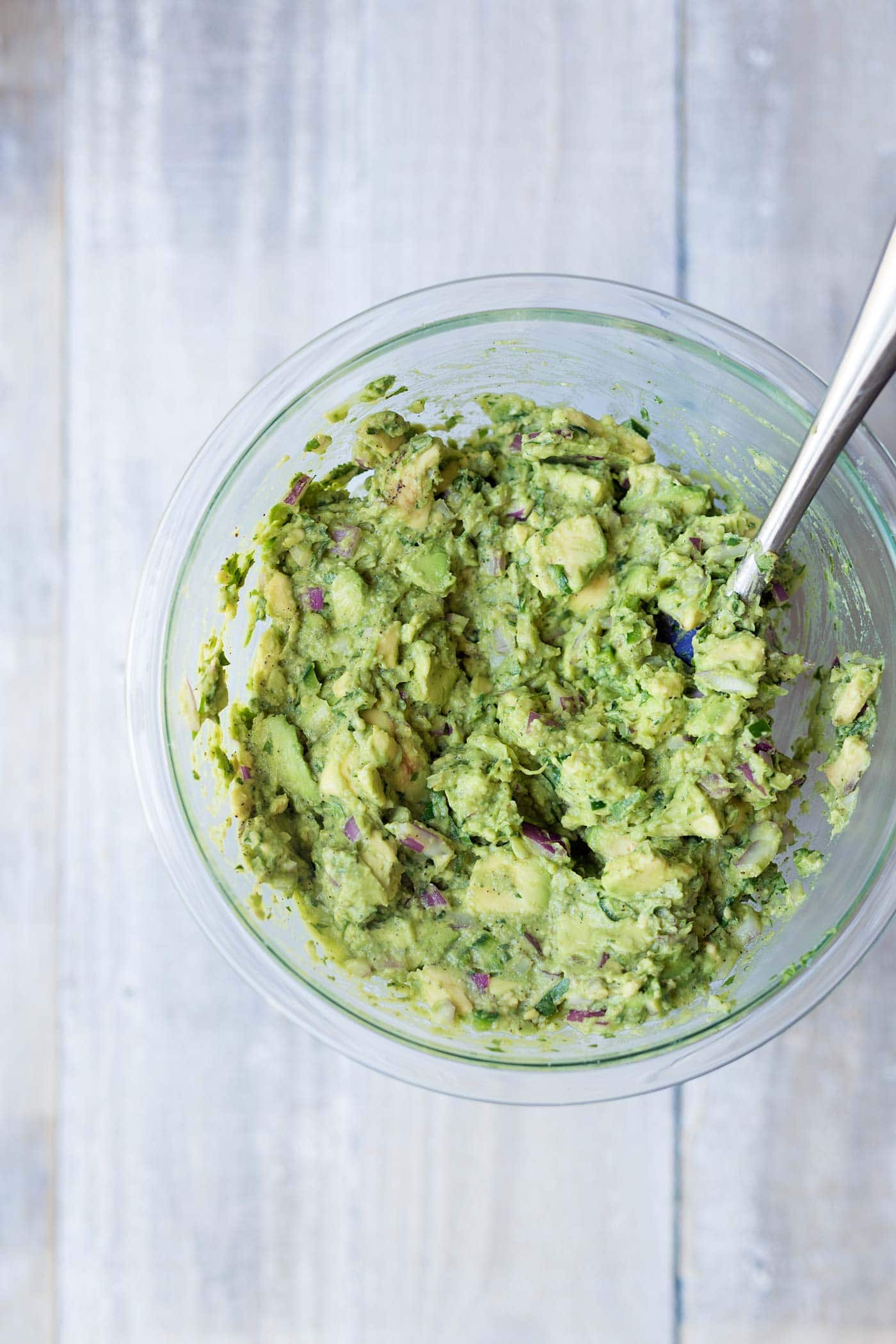 Learn how to make perfect guacamole that will stay fresh and bright green for days! Get the recipe and technique from Savory Simple.
