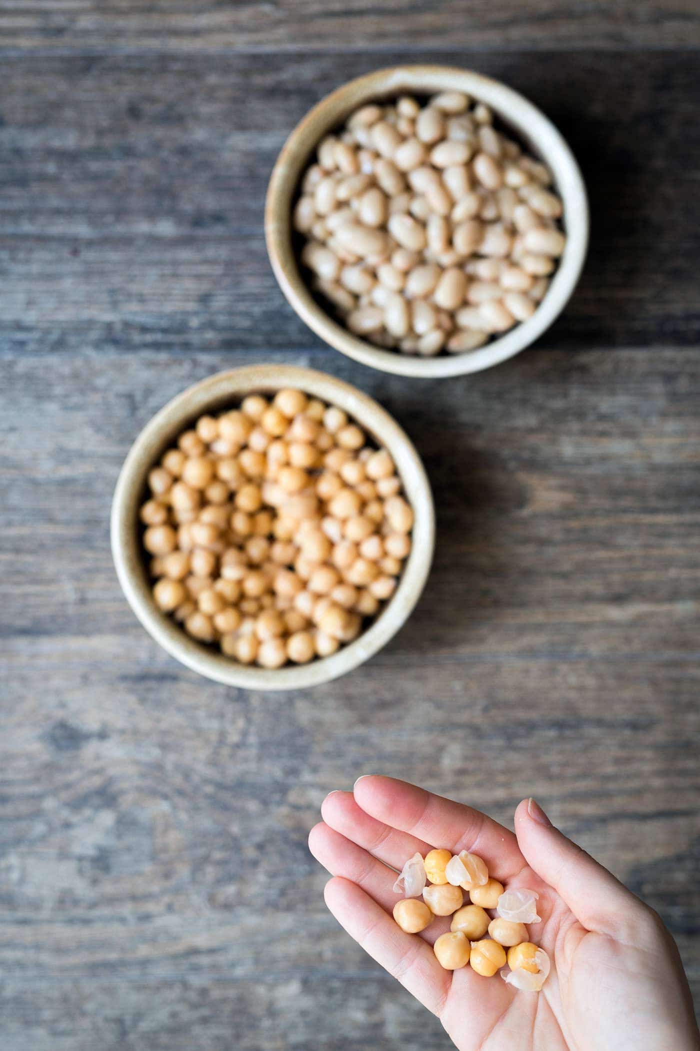 Chickpeas and white beans, with a close up of chickpea skins.