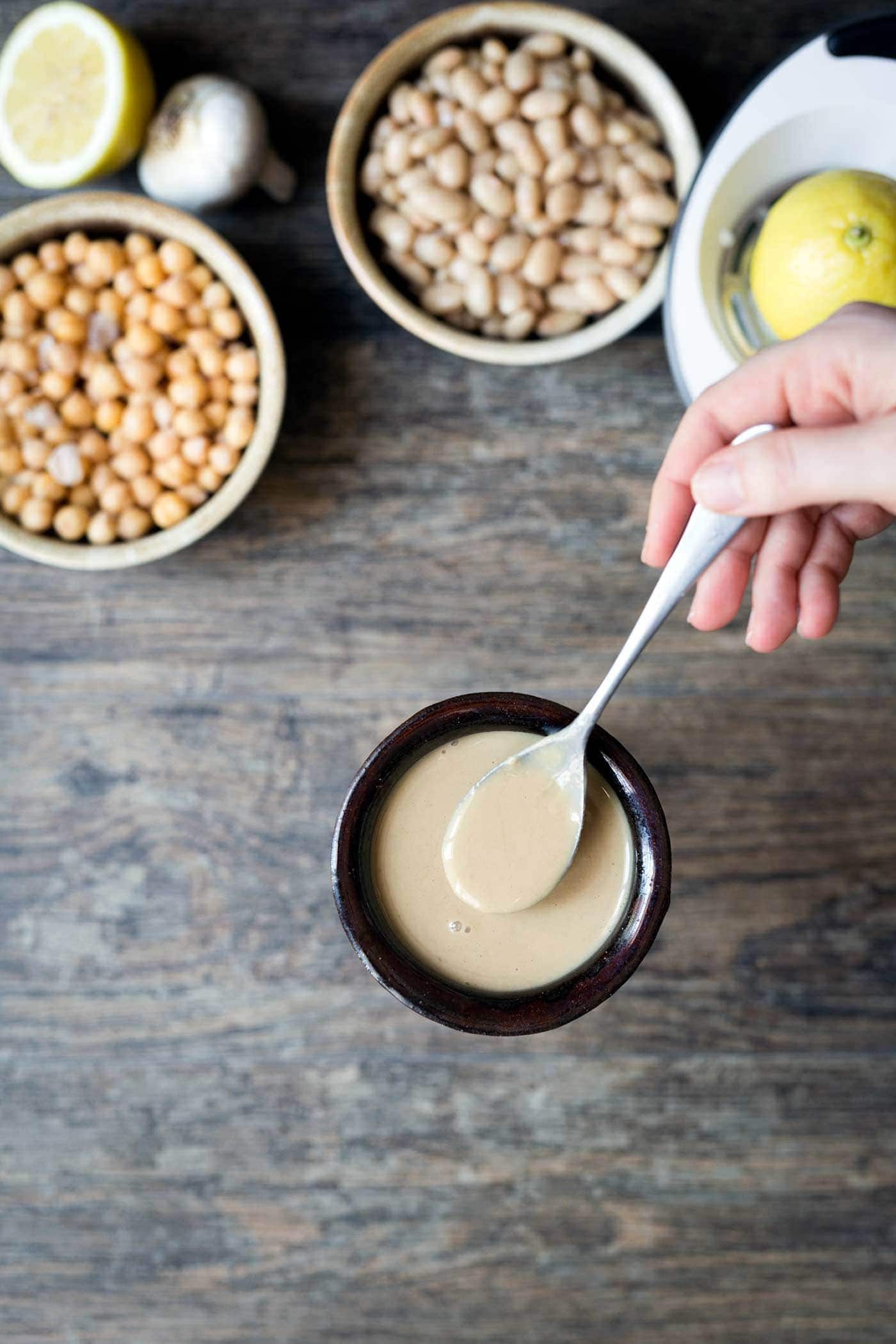 Well-stirred tahini about to be added to hummus.