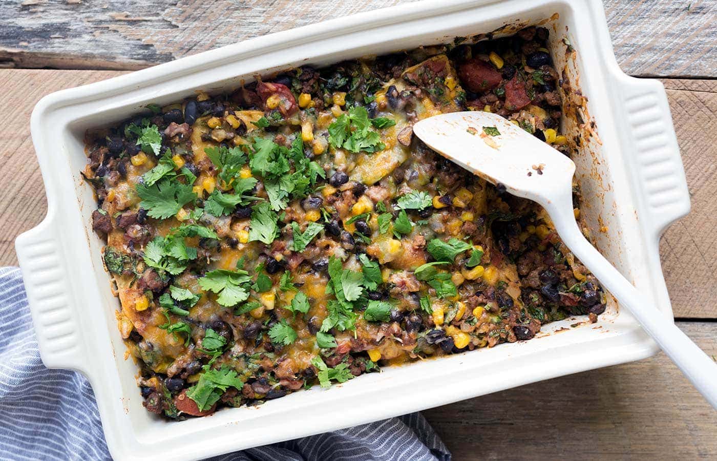 A photo of cheesy chorizo tortilla casserole, fresh from the oven. 