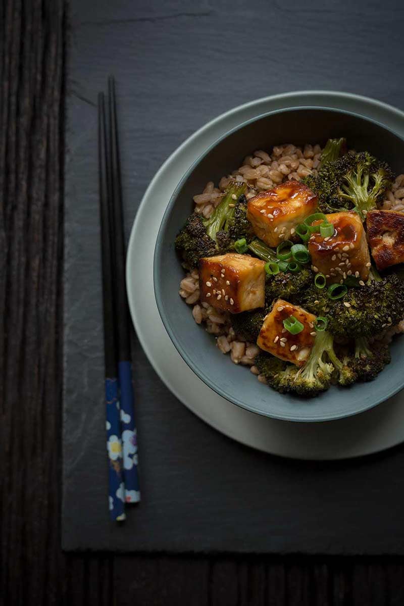 Crispy baked tofu recipe in a bowl with chopsticks