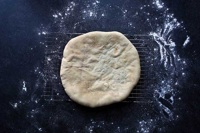 A photo of homemade pizza dough fresh out of the oven.