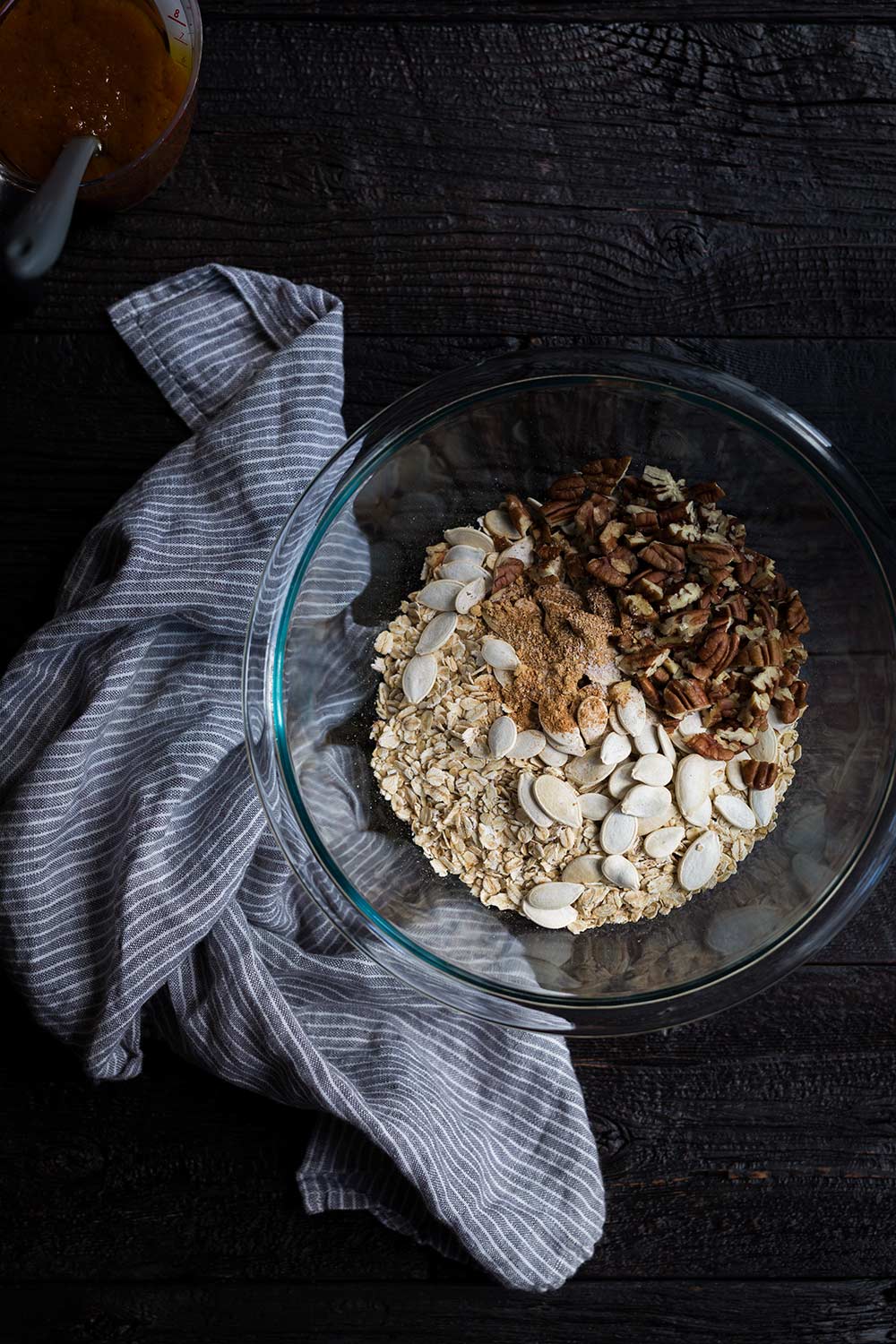 A photo of dry granola ingredients ready to be combined with the wet ingredients.