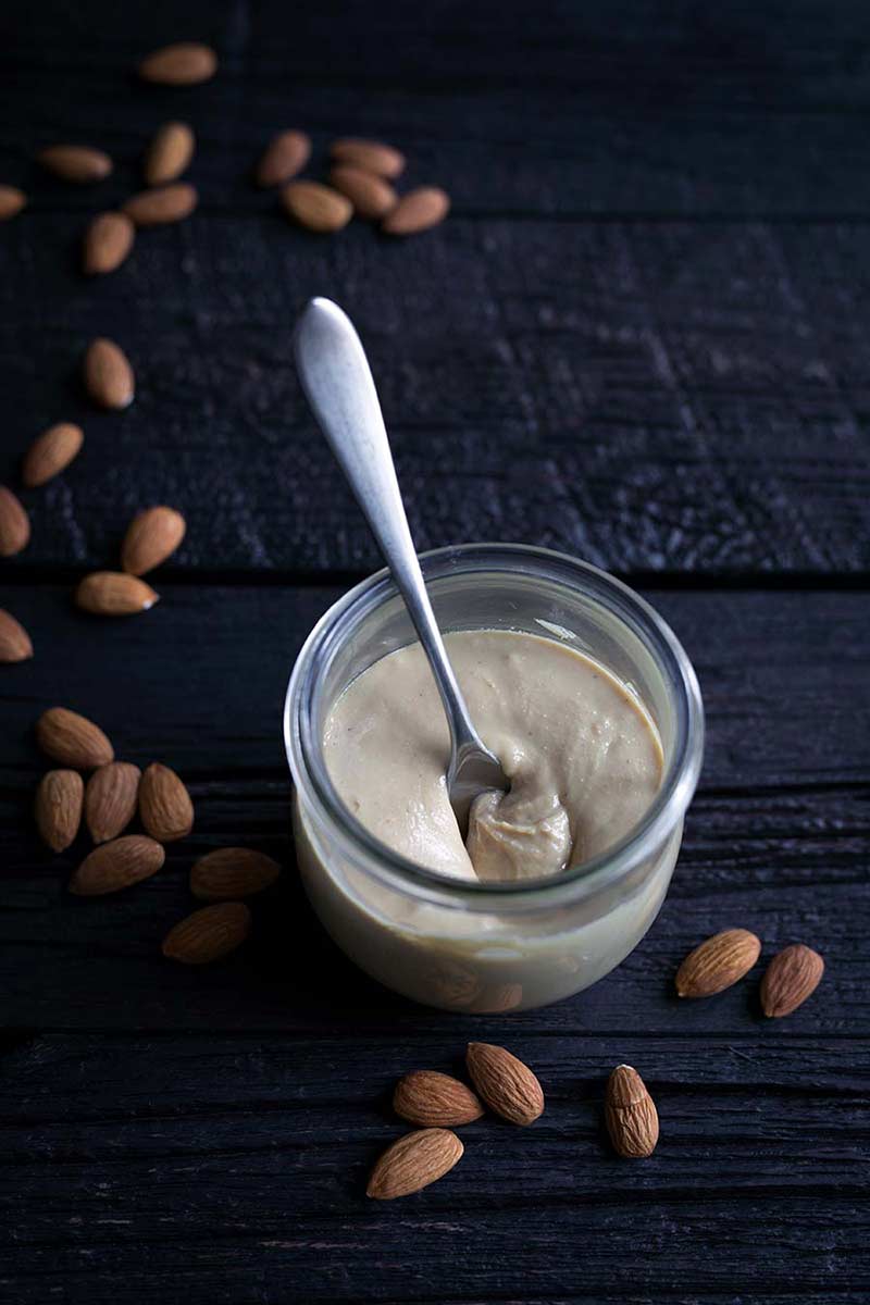 A photo of this homemade almond butter recipe in a mason jar.