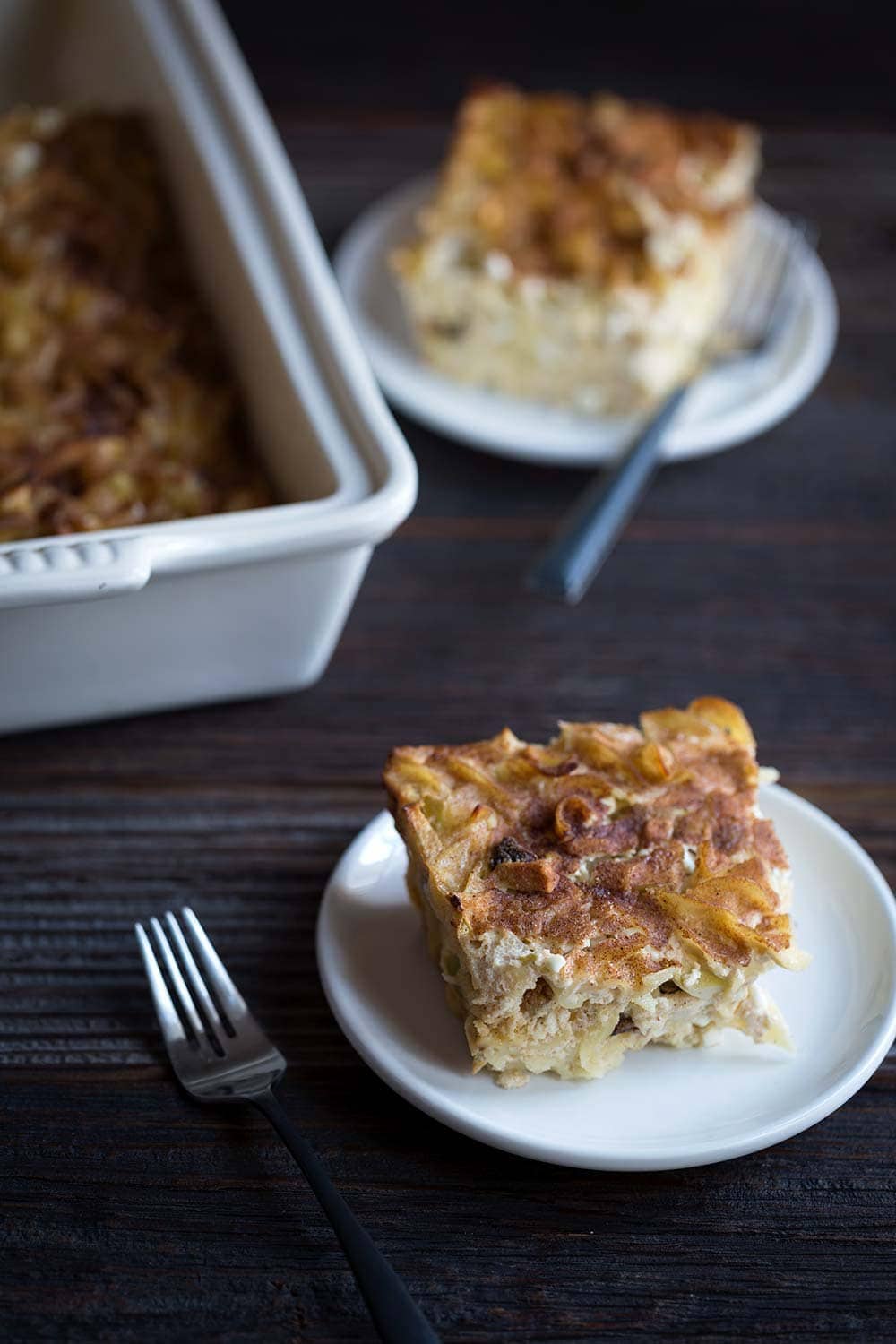 A photo showing slices of apple noodle kugel.