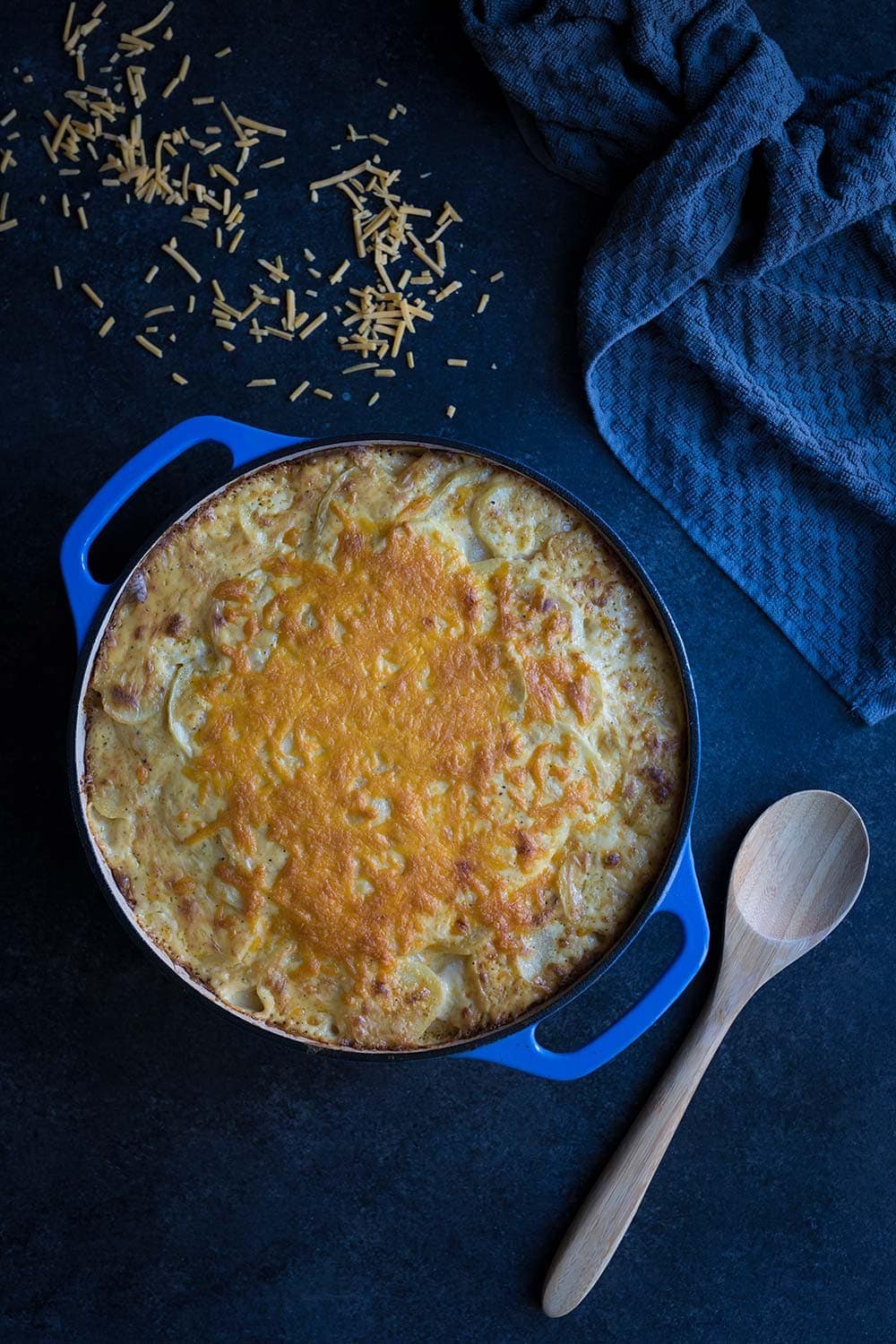 This Cheesy Potatoes Au Gratin recipe is perfect for celebrating the holidays with friends and family! Sharp cheddar cheese takes it to a whole new level.