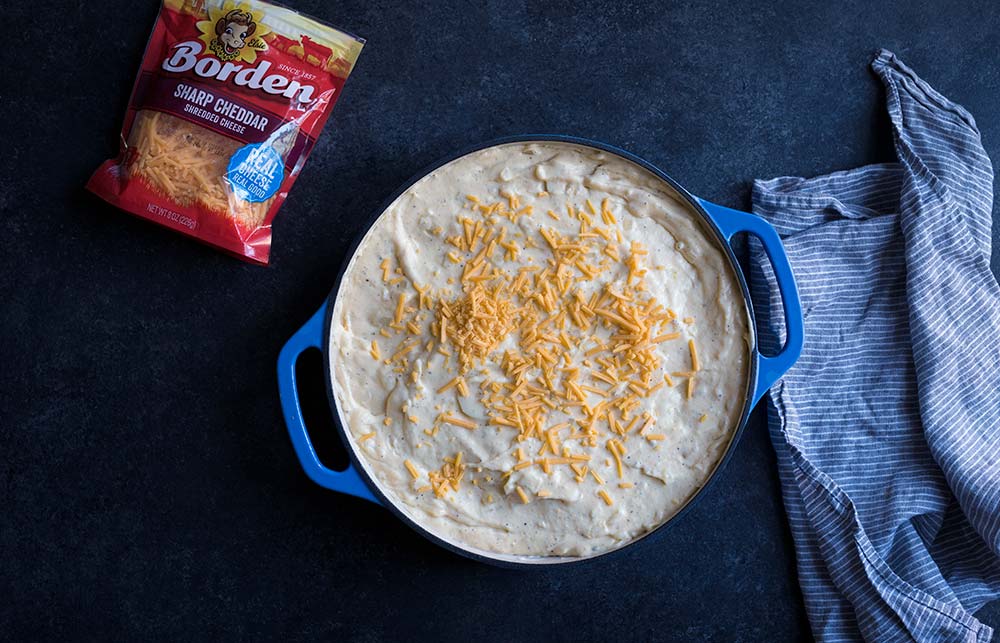 A photo of the finished layers of potato gratin, about to be placed into the oven. 