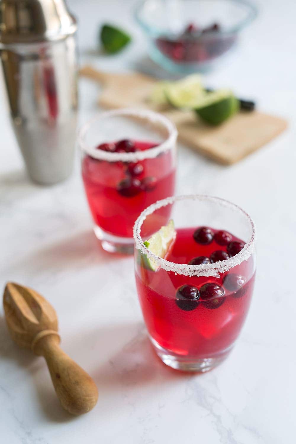 This cranberry margarita is a fast and easy New Year's Eve cocktail that everyone will love! Fresh cranberries add vibrant color, while tart cranberry juice balances with lime juice, orange liqueur, and as always, tequila.