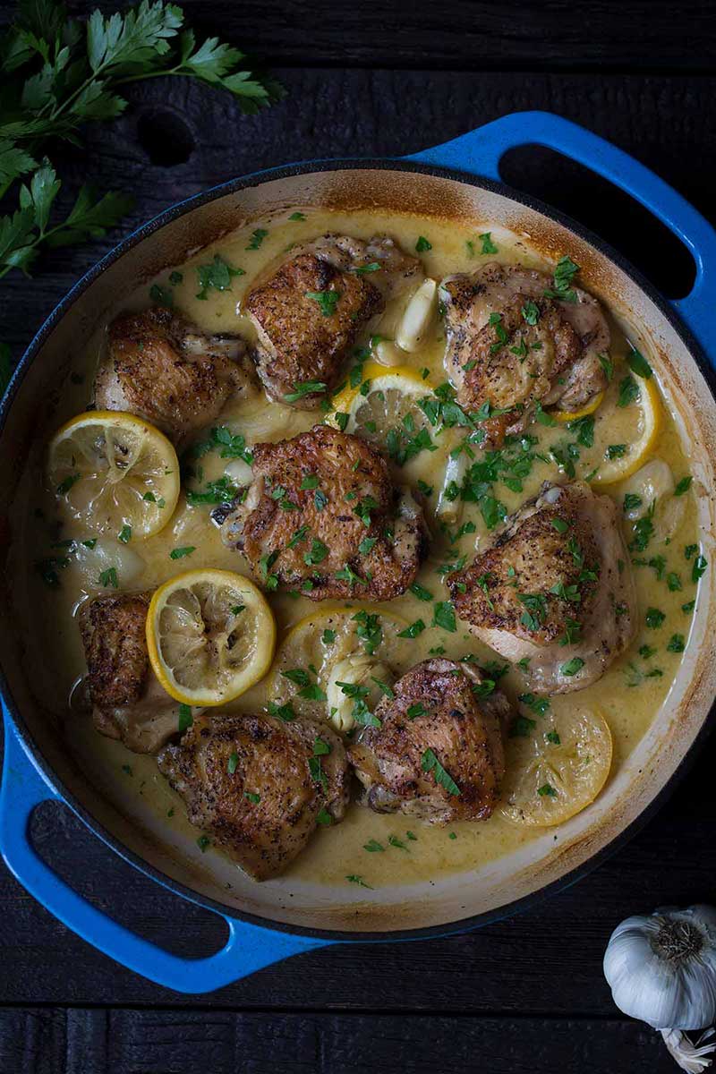 crispy chicken thighs in a round casserole dish