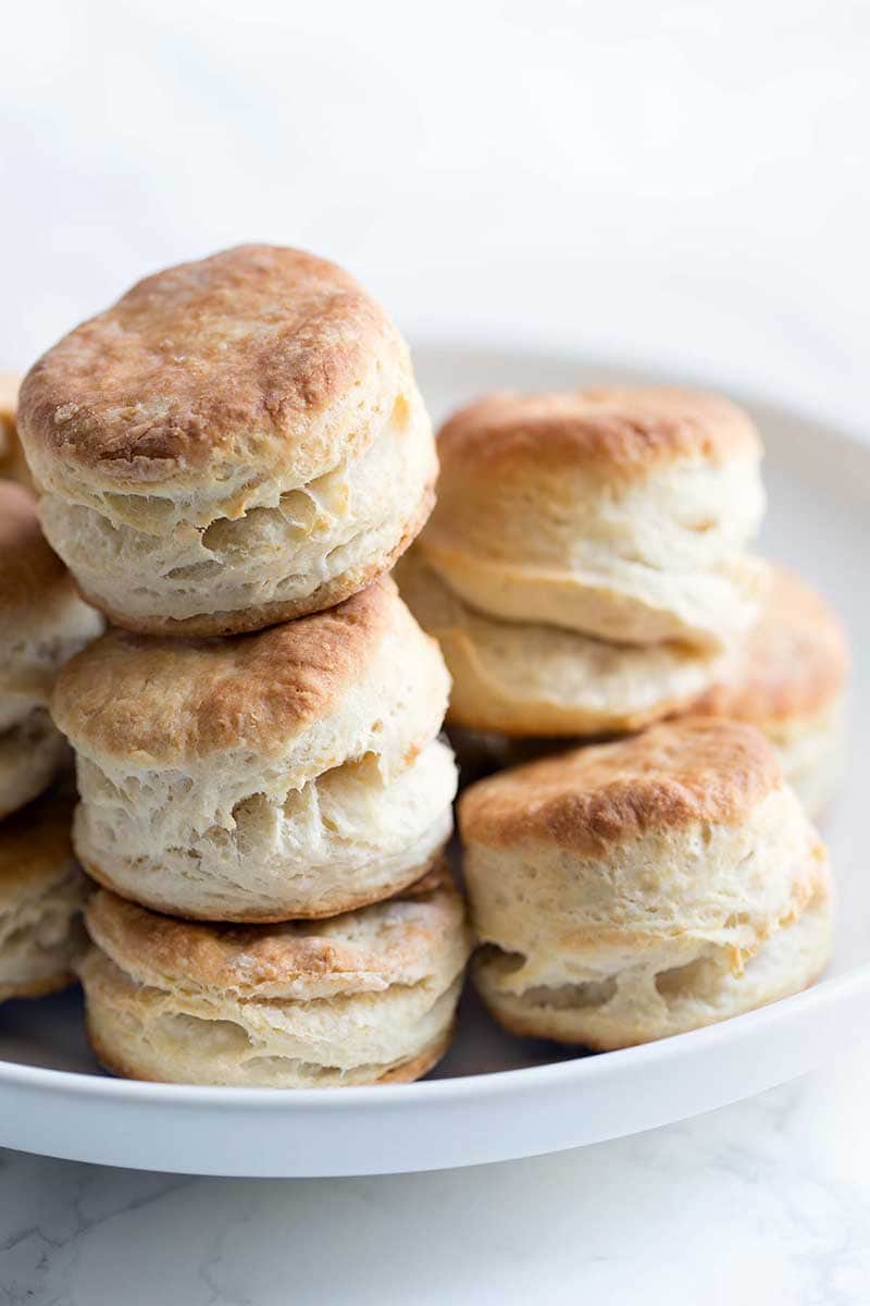 A close up of mile high homemade biscuits prepared using buttermilk. Super light and fluffy.