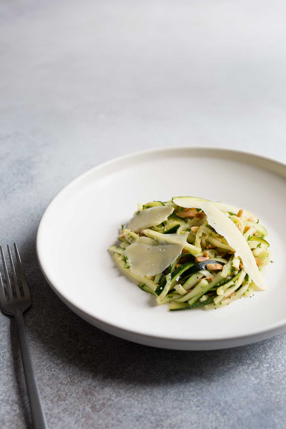 Zucchini salad topped with shaved cheese