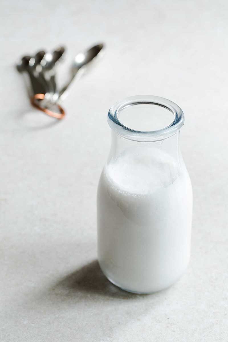 Homemade buttermilk substitute in a milk bottle.