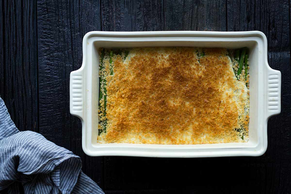 Breadcrumbs on top of homemade gratin in a casserole dish.