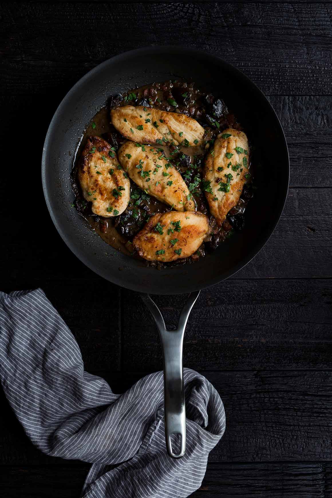 Chicken Marsala in a large nonstick skillet, topped with fresh parsley.