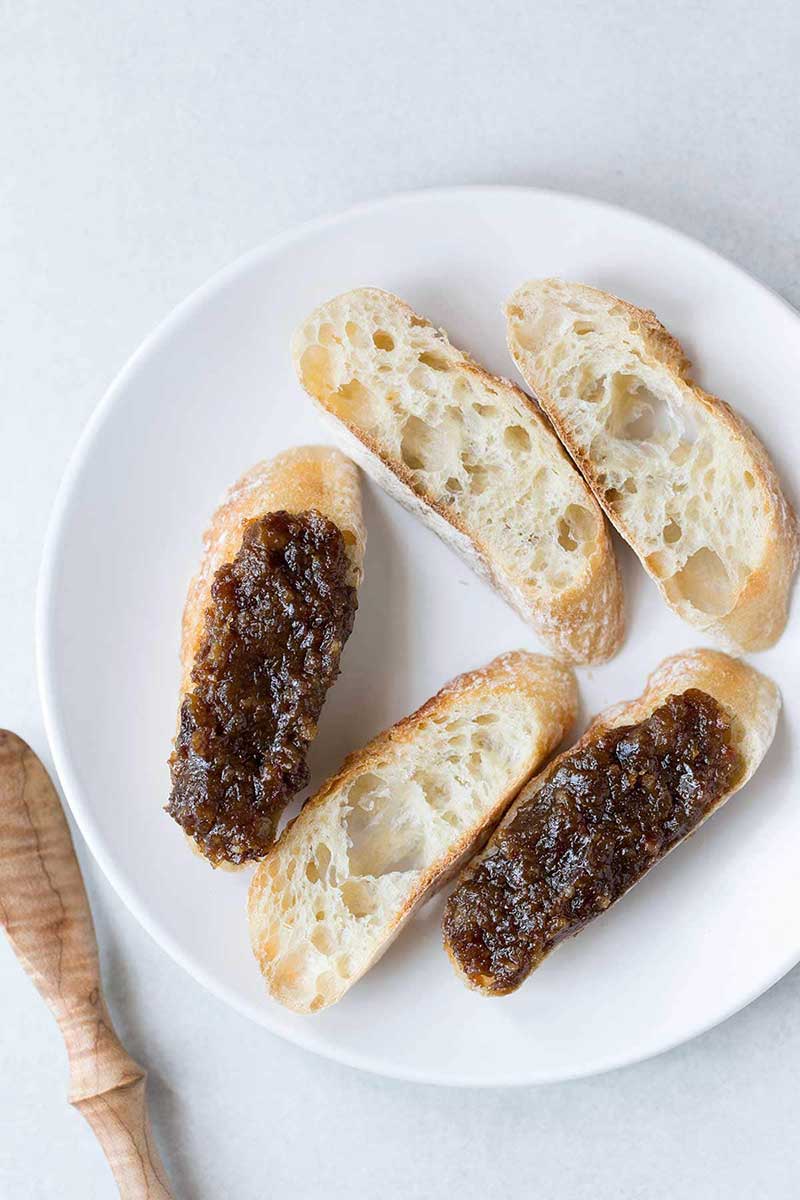 Bacon jam spread on crostini.