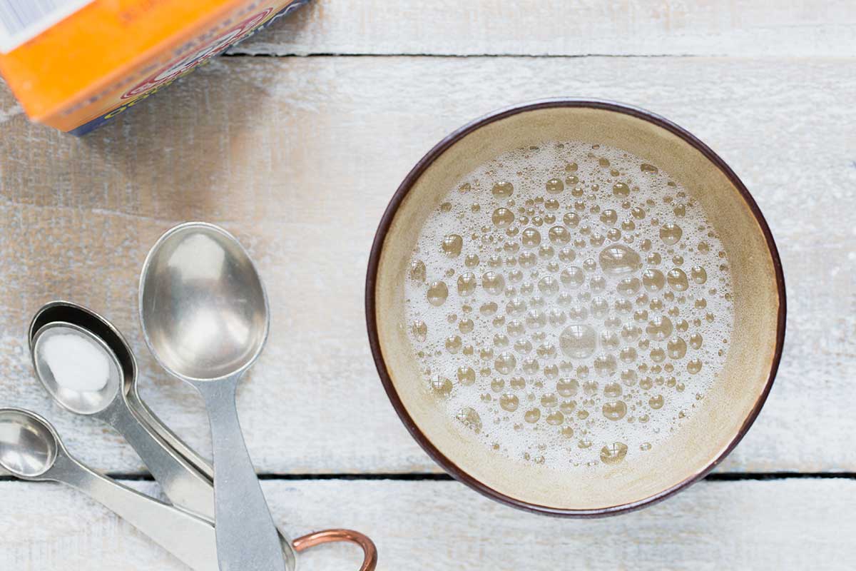 Testing baking soda to make sure it's still active by adding vinegar