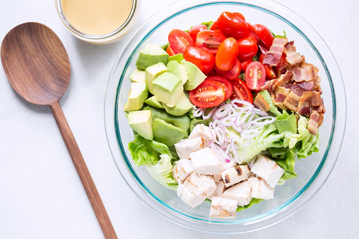 An overhead shot of an avocado chicken salad recipe in a large bowl
