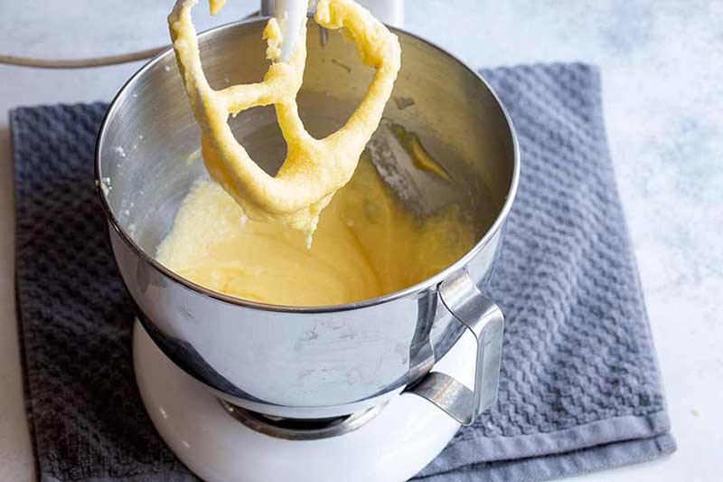 egg, butter, and sugar mixed together in standing mixer