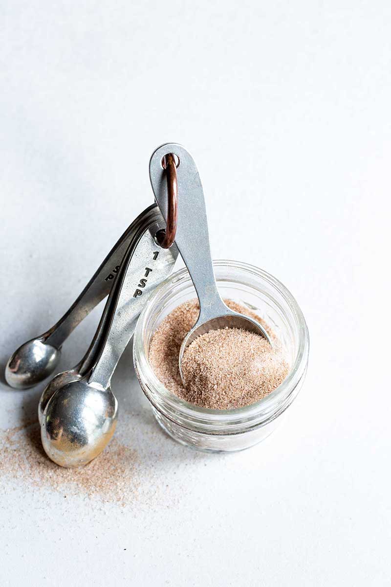 Cinnamon-Sugar Recipe in a mason jar with measuring spoons