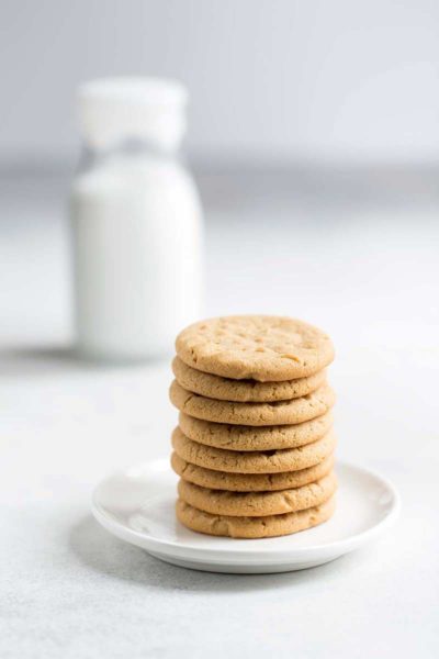 A stack of old fashioned peanut butter cookies on a plate