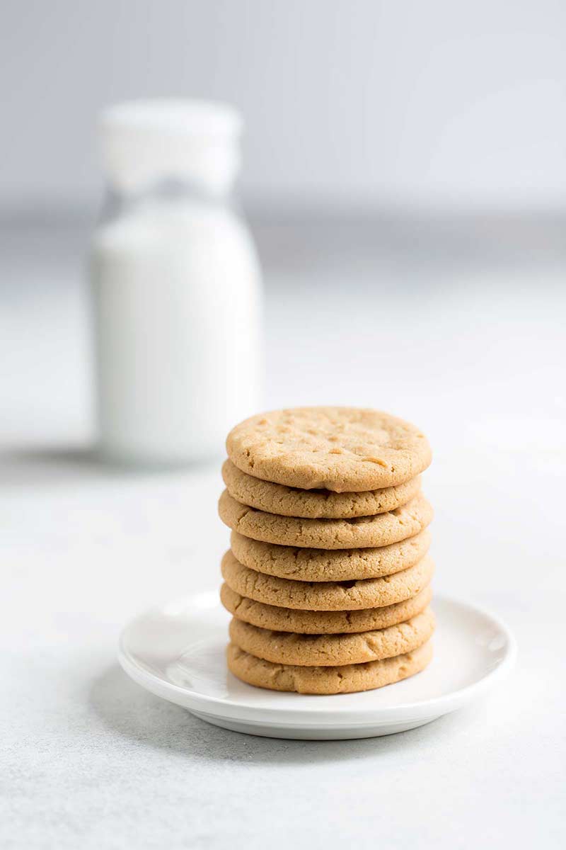 A stack of Peanut butter cookies on a plate
