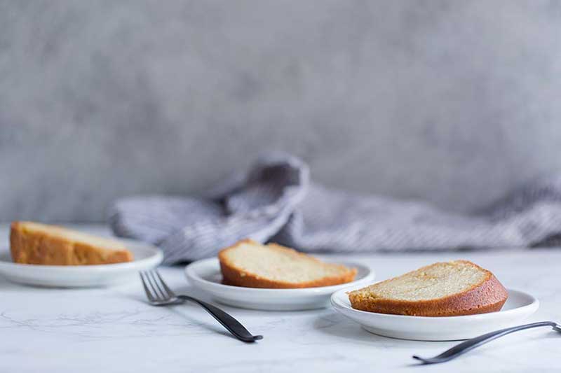 Three Bermuda rum cake recipe slices on plates