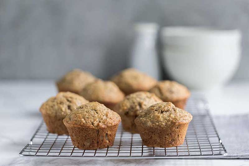 A photo of banana bread muffins on a cooling rack