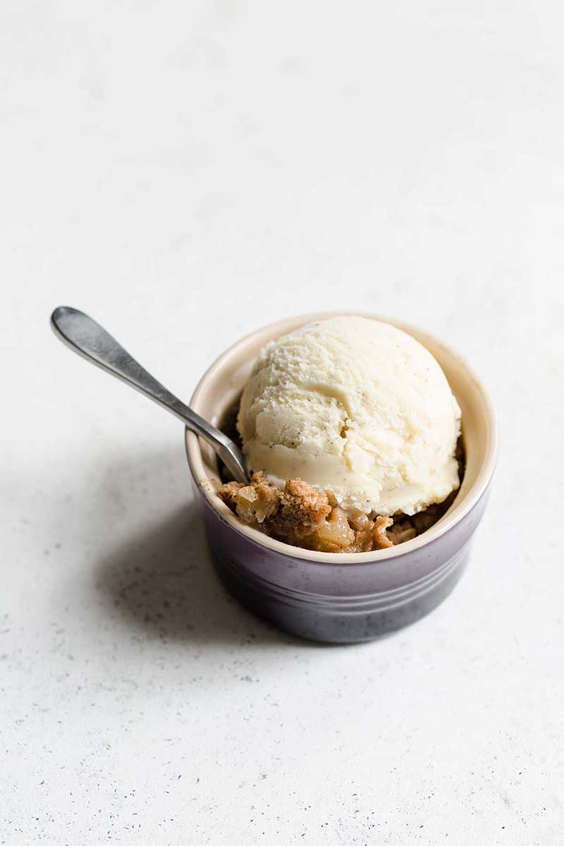 apple crumble recipe in a ramekin with a spoon