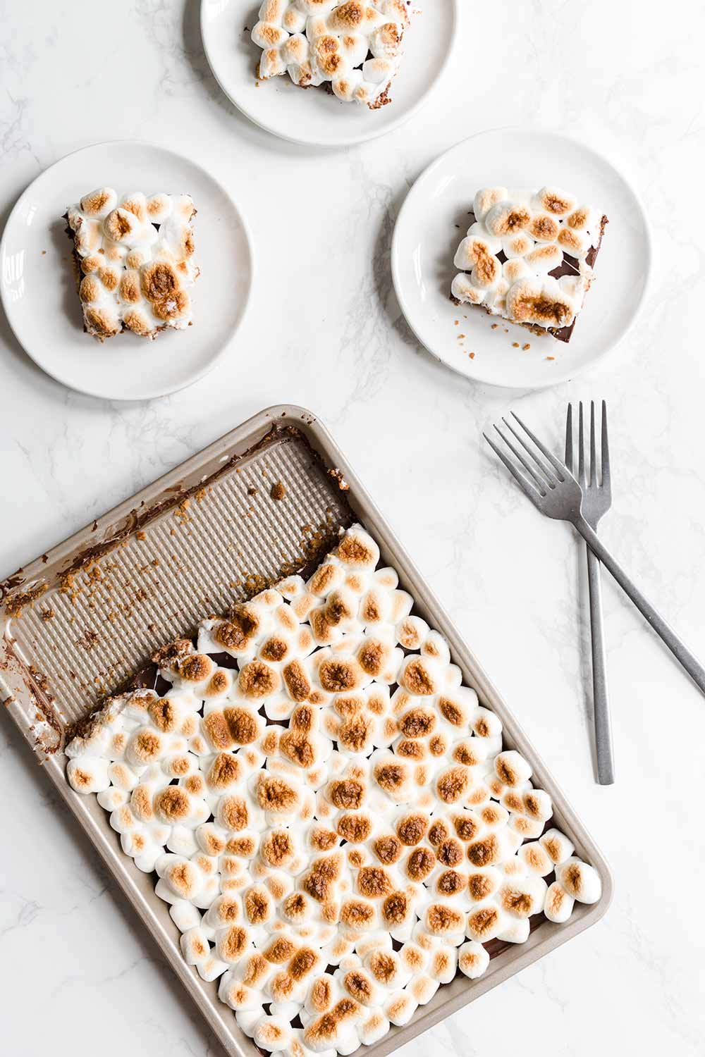 Finished s'mores slab pie next to 3 slices