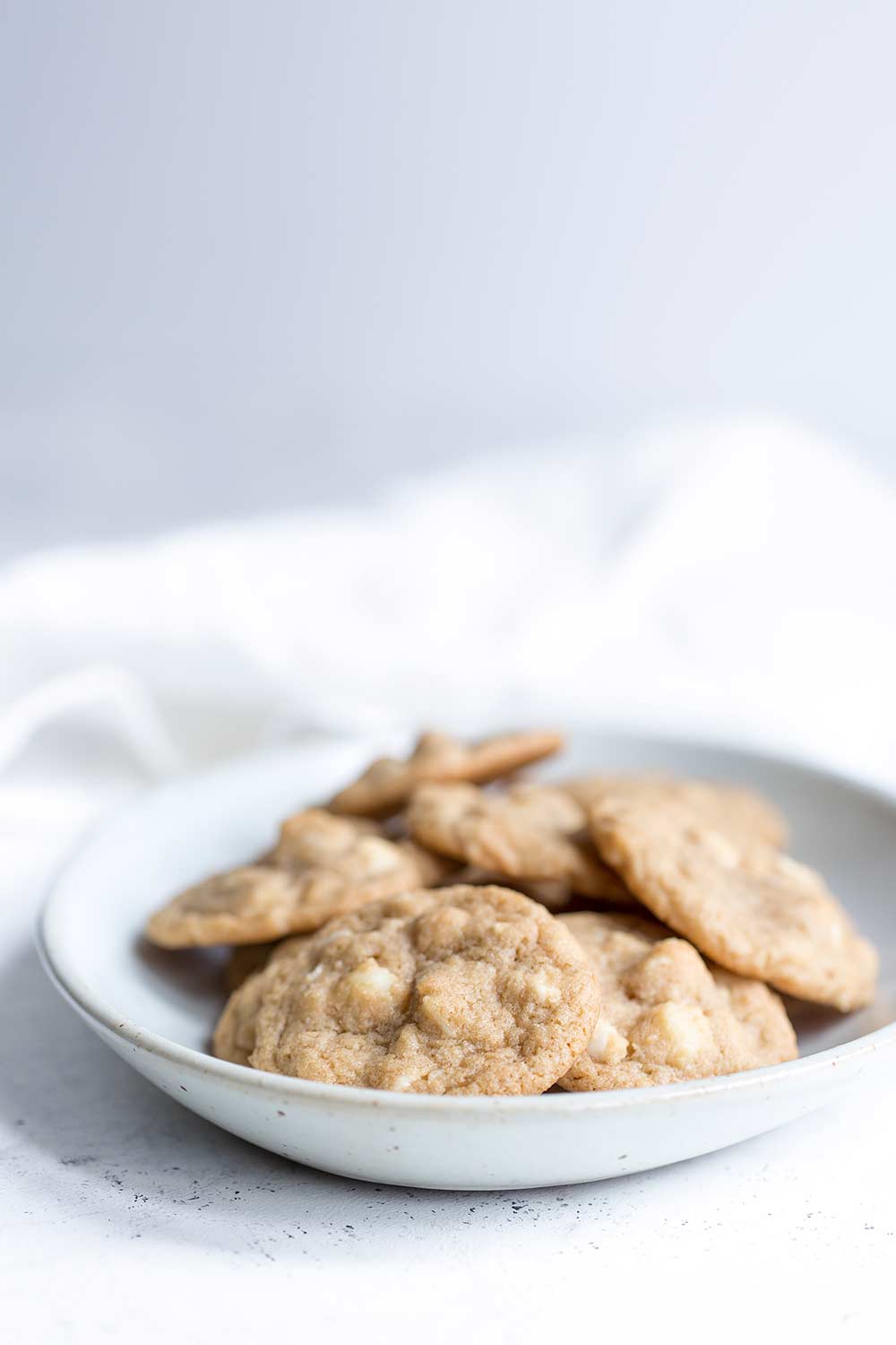 White chocolate macadamia nut cookies in a serving bowl