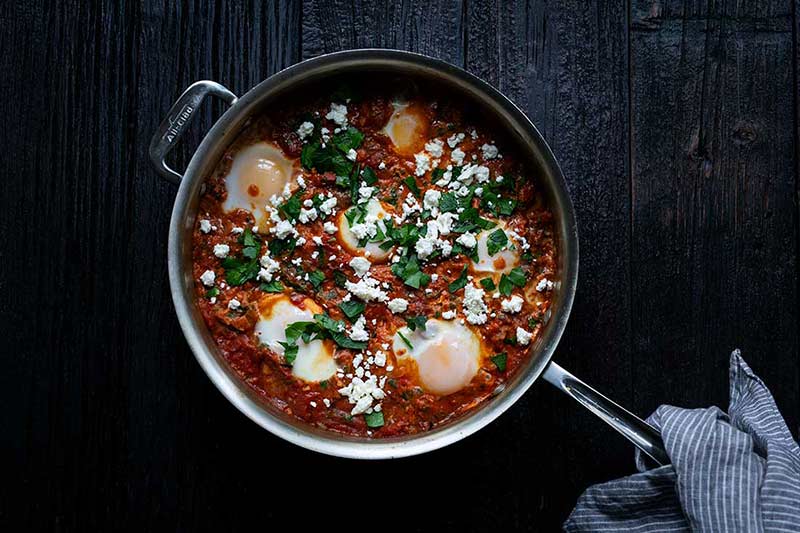 Homemade Shakshuka with pan tilted upward