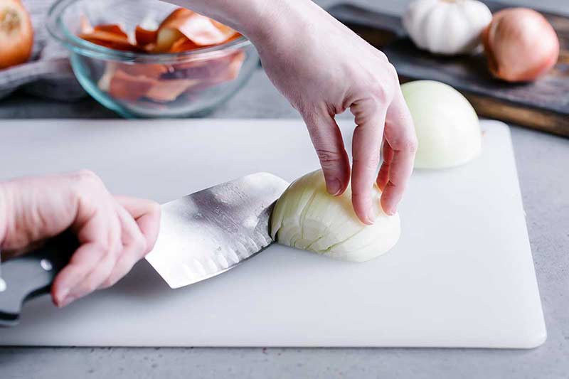 How to chop an onion picture with knife to left