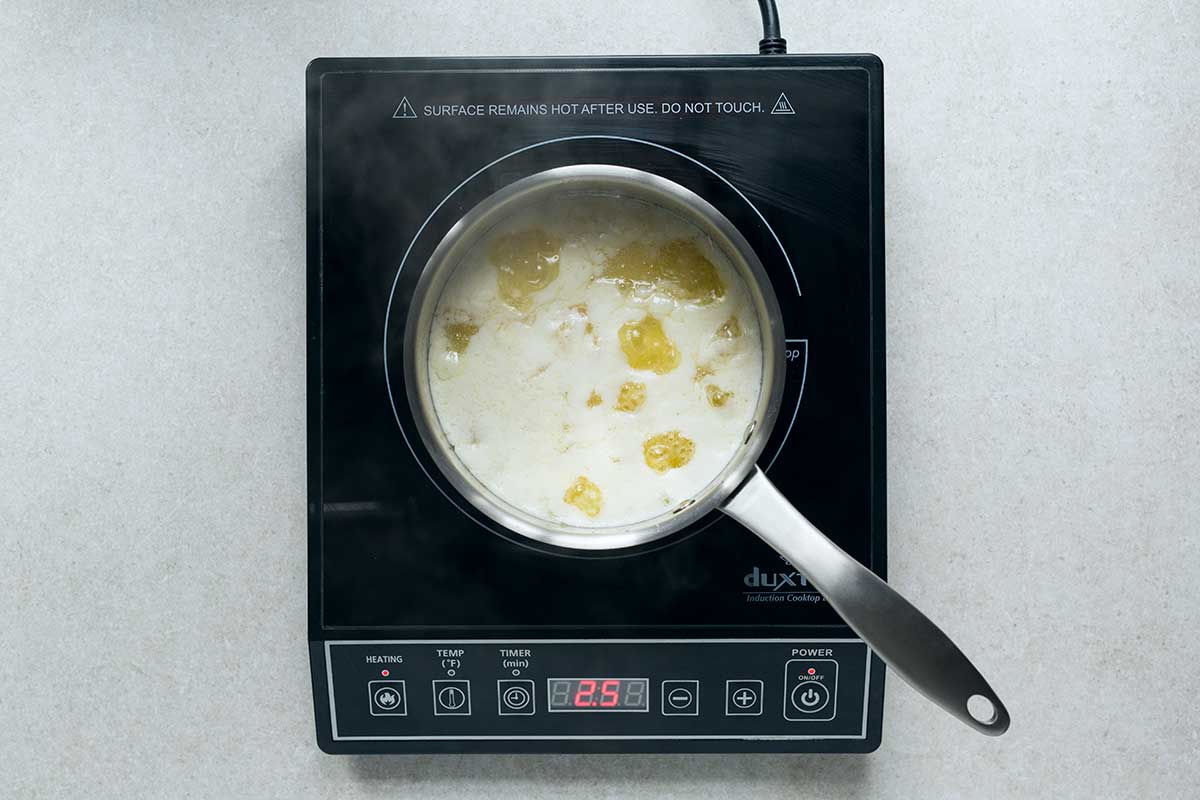 Clarified butter tutorial with the butter beginning to boil