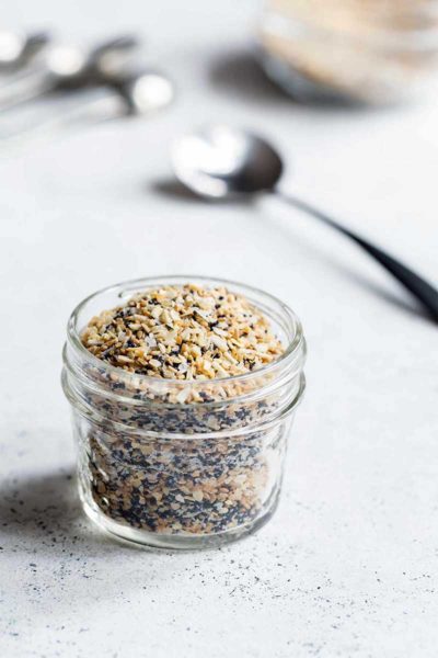 Everything bagel seasoning in mason jar with a spoon