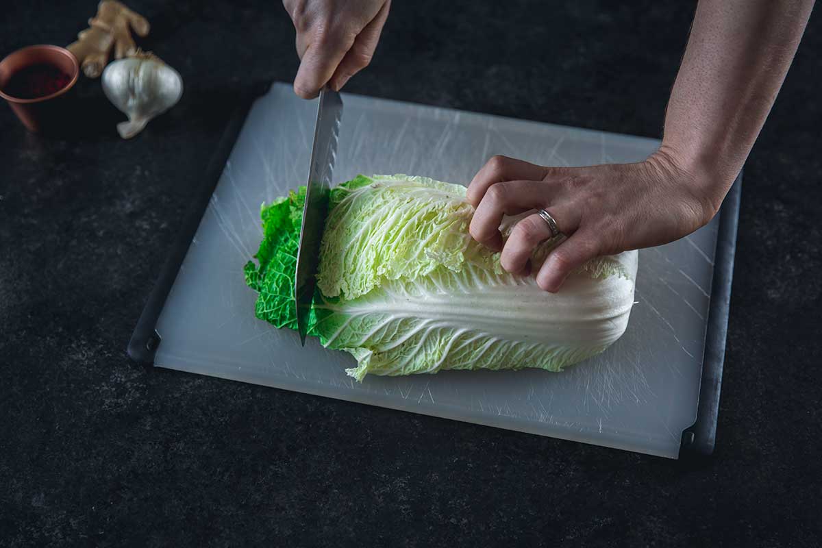 Slicing napa cabbage on a cutting board