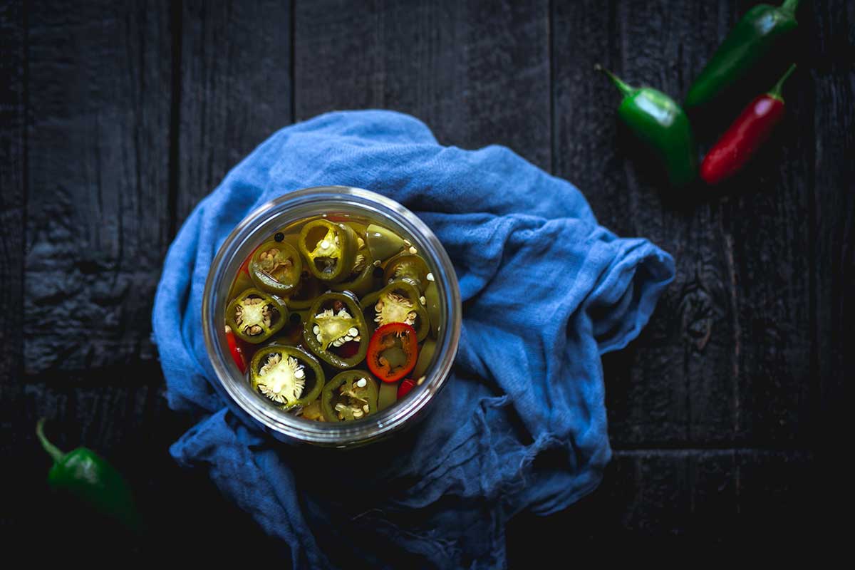Pickled jalapeños in a mason jar