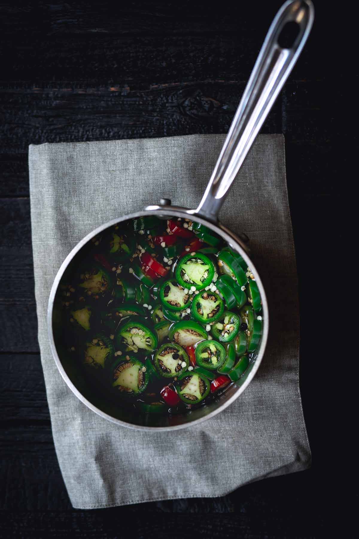 Pickled jalapeno ingredients in a saucepan